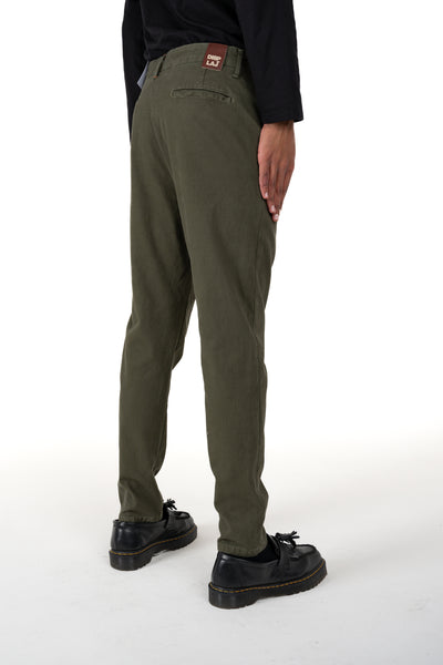 Pantaloni carrot New Private Saturno verde